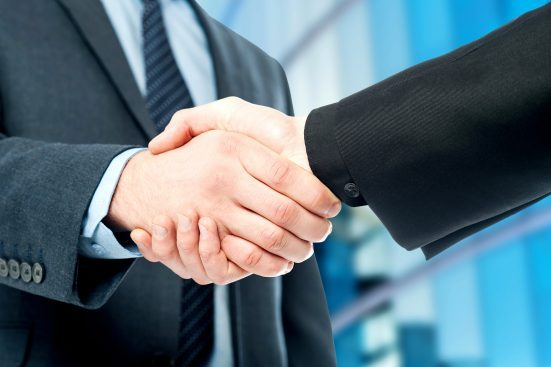 Business handshake, the deal Is finalized.